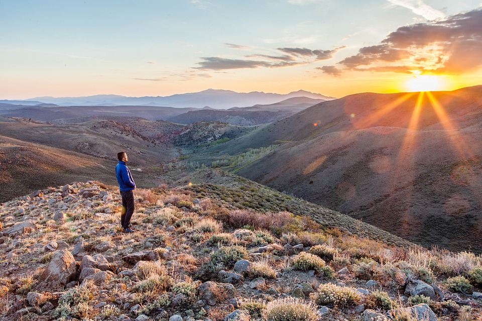 man climbing a mountain